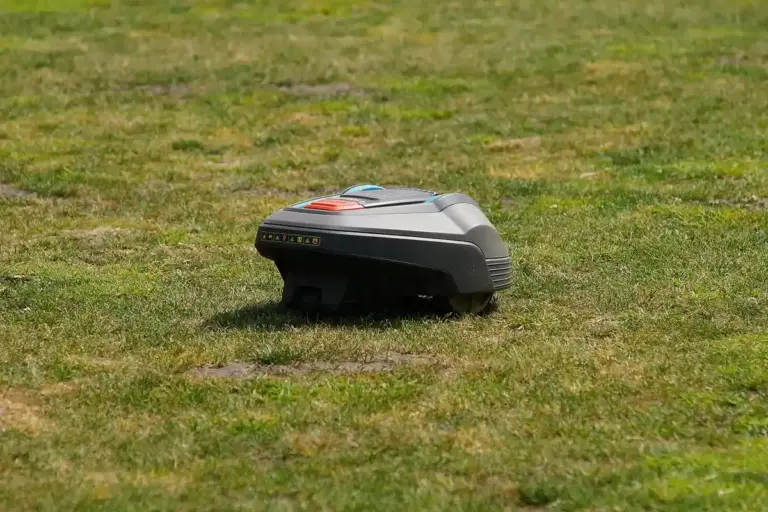 Autonomous robotic lawn mower gliding across a lawn